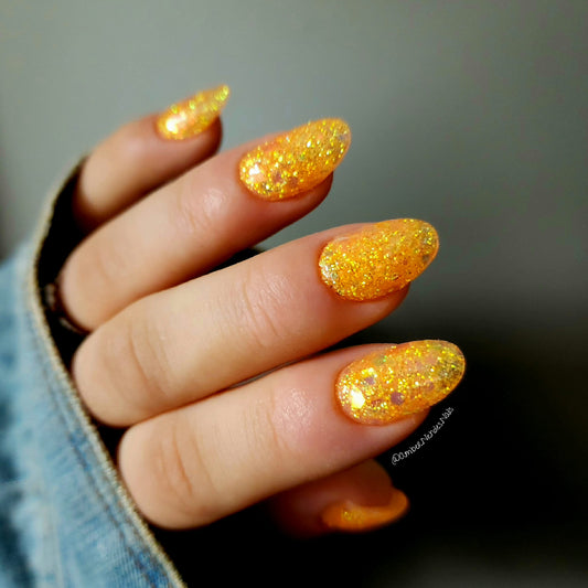 Orange glitter dip powder manicure