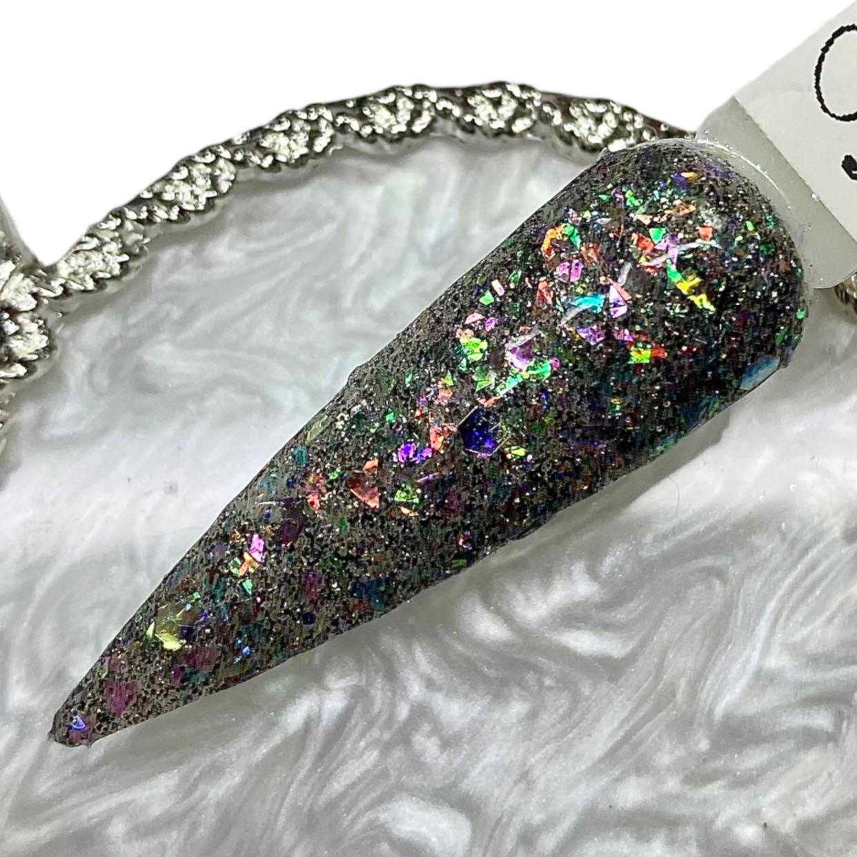 black glitter and multicolored flakes